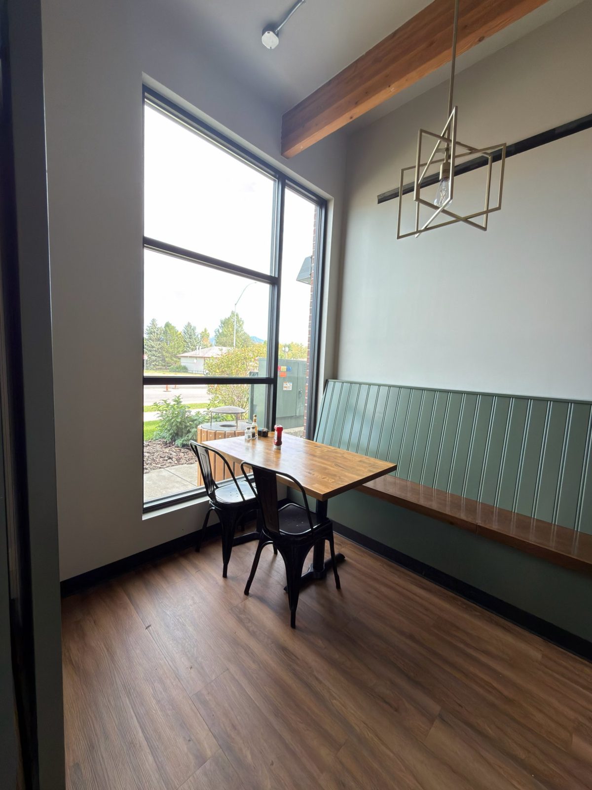 A window table in the back room with a view of the mountains