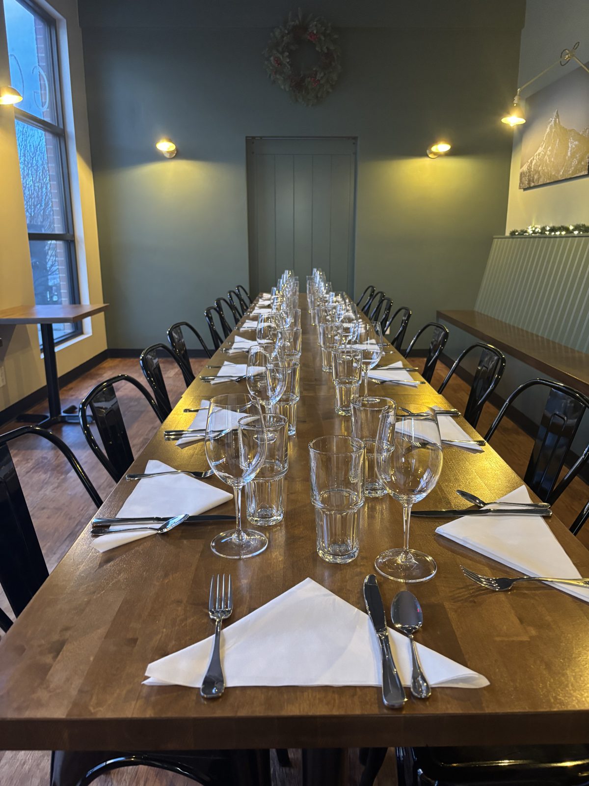 A long table set for a private dinner at Crossings Kitchen